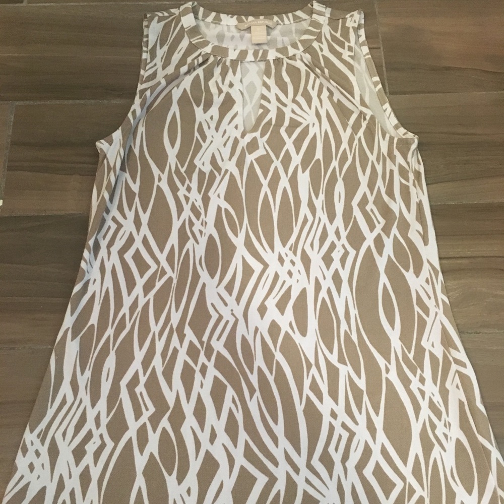 Sleeveless tan/white patterned blouse